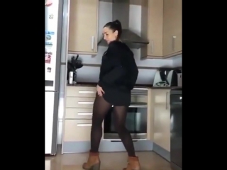 sister twirls booty in the kitchen